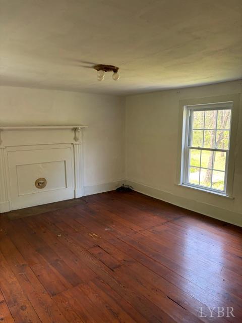 3770 Elon Road Monroe, VA 24574 - Photo 17 of 17 an empty room with wooden floor and windows
