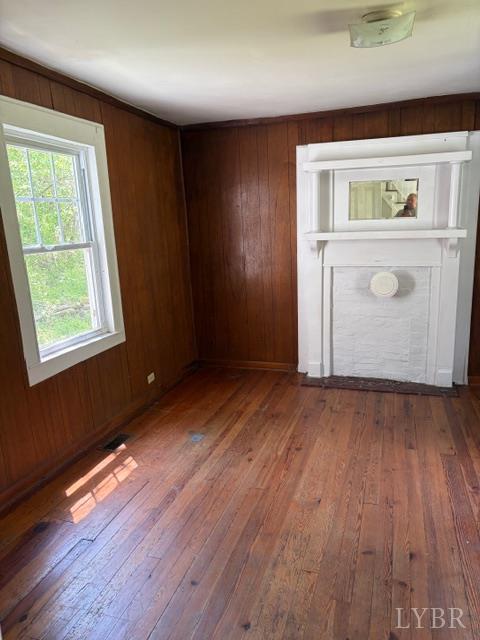 3770 Elon Road Monroe, VA 24574 - Photo 10 of 17 an empty room with wooden floor and windows