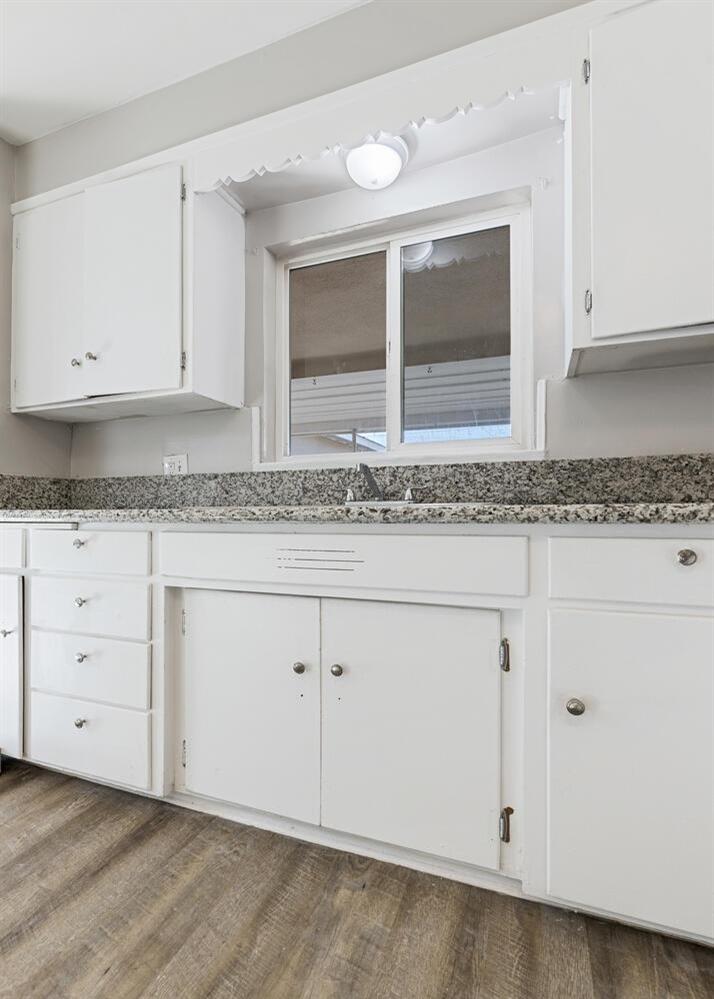 1265 South Klein Avenue Reedley, CA 93654 - Photo 14 of 31 a view of cabinets with granite countertop cabinets