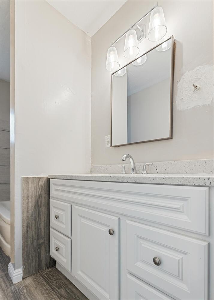 1265 South Klein Avenue Reedley, CA 93654 - Photo 22 of 31 a bathroom with a sink vanity and mirror