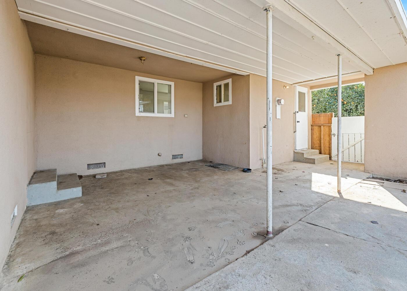 1265 South Klein Avenue Reedley, CA 93654 - Photo 28 of 31 a view of a livingroom with wooden floor and a window