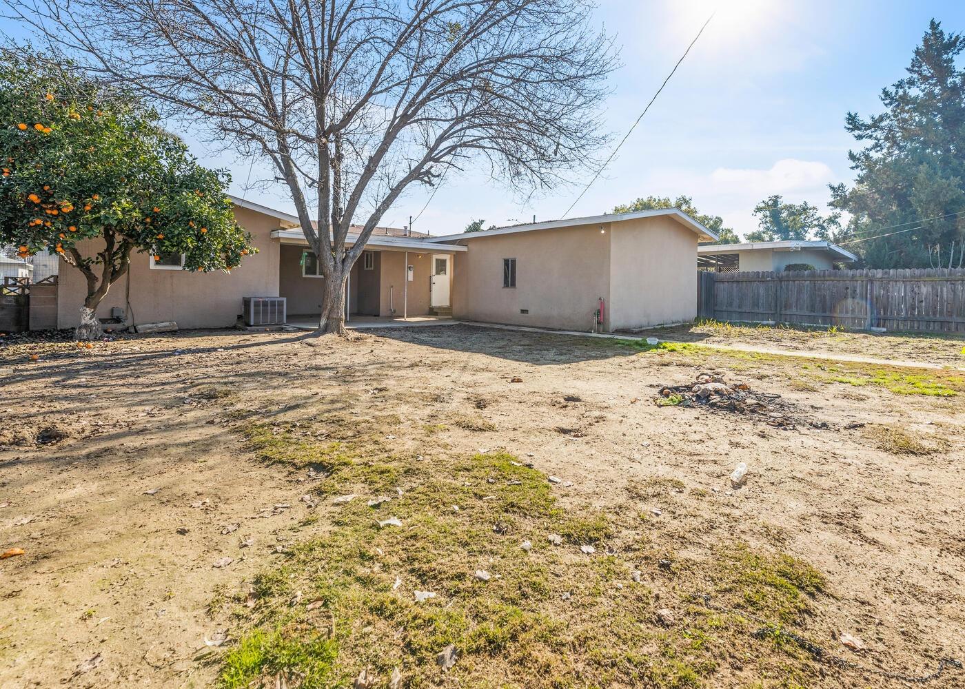 1265 South Klein Avenue Reedley, CA 93654 - Photo 29 of 31 a house with a covered with wooden fence