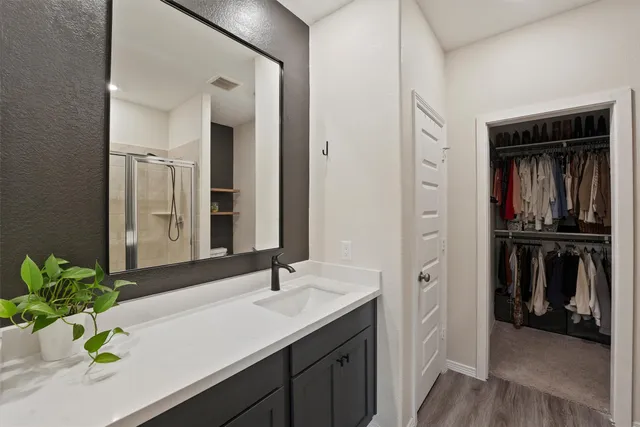 a bathroom with a sink a faucet and a mirror