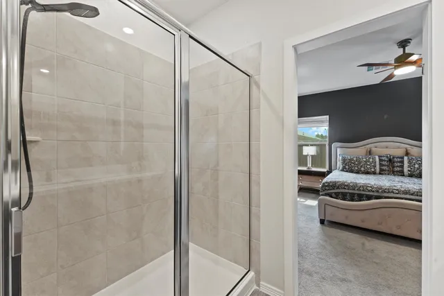 a bedroom with a bed and a mirror