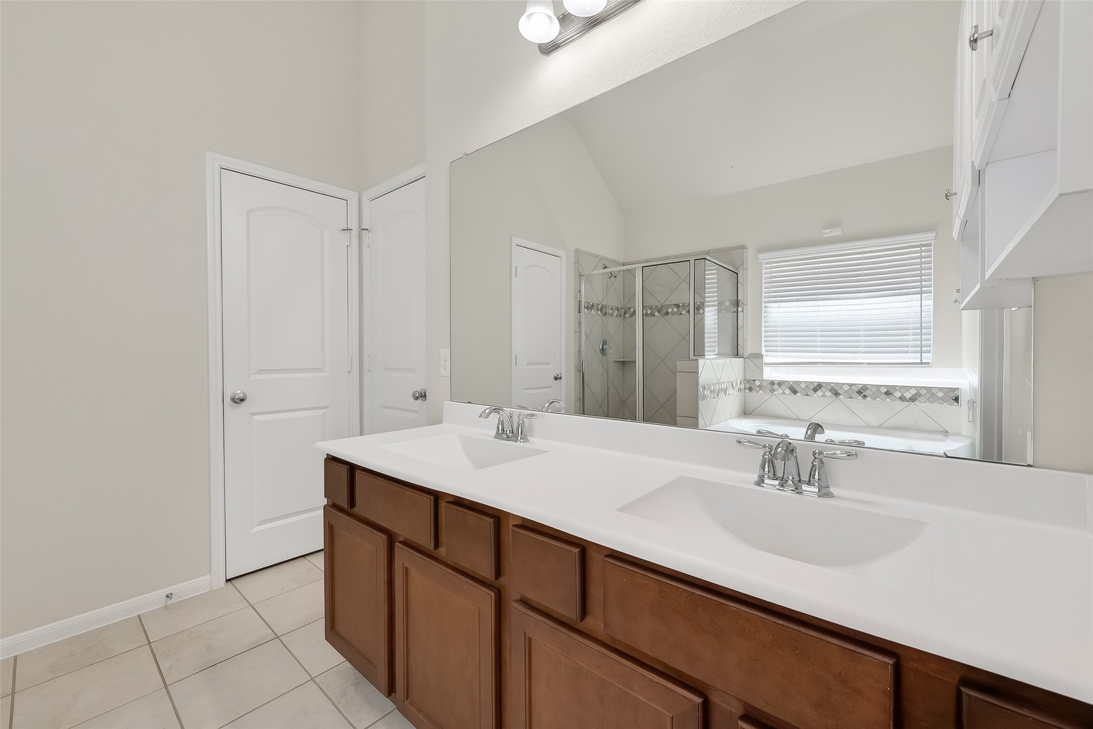 7631 Granite Terrace Lane Houston, TX 77083 - Photo 28 of 46 a bathroom with a sink and a mirror