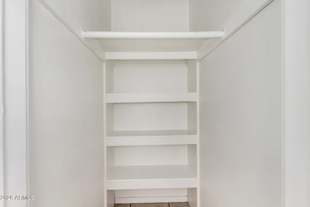 a view of an empty walk in closet