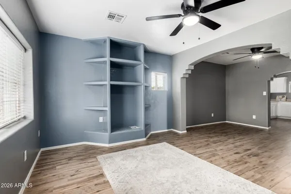 a view of a bedroom with closet and windows