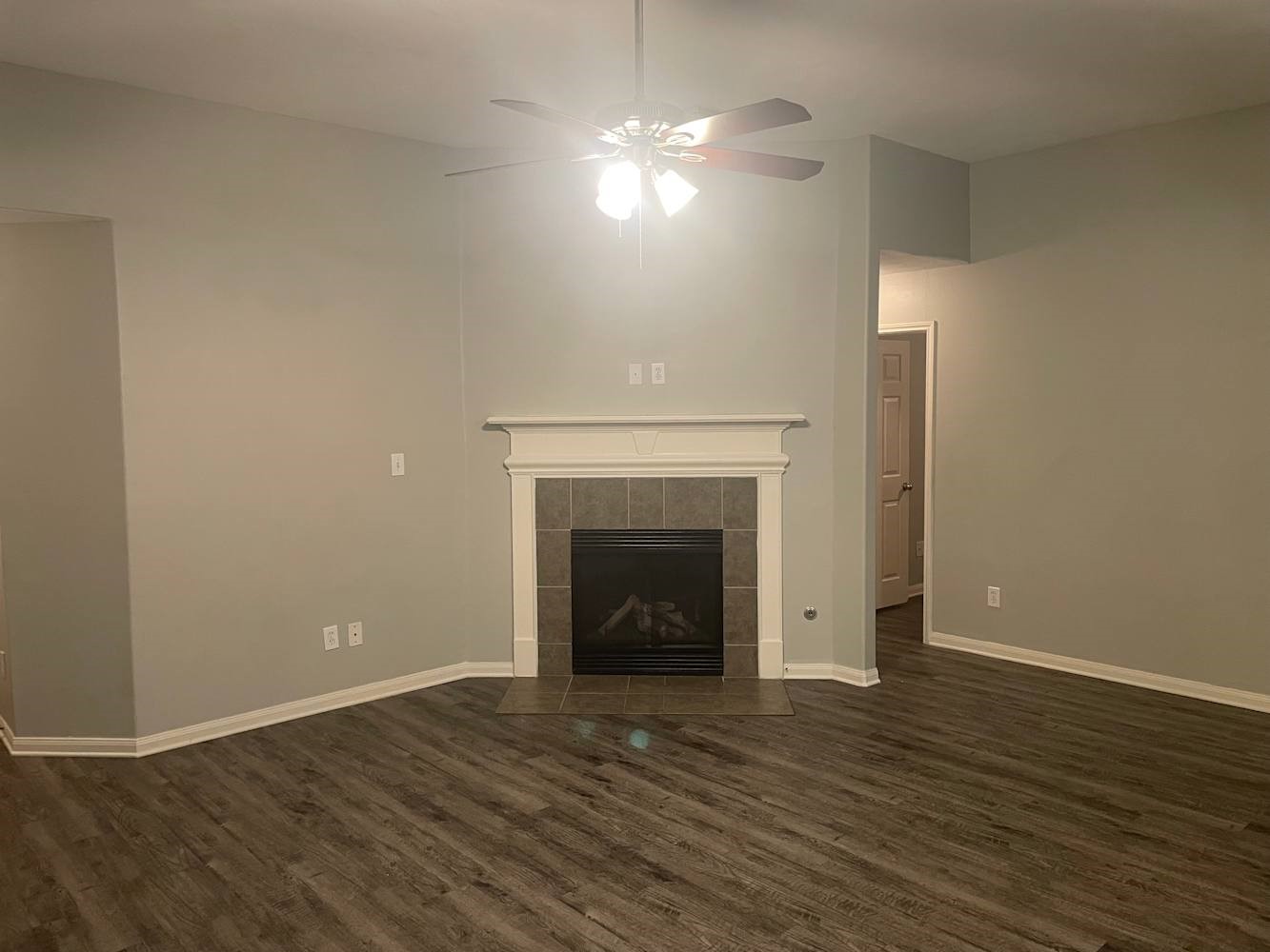 3335 Fiorella Way Humble, TX 77338 - Photo 2 of 10 a view of a livingroom with wooden floor and a fireplace