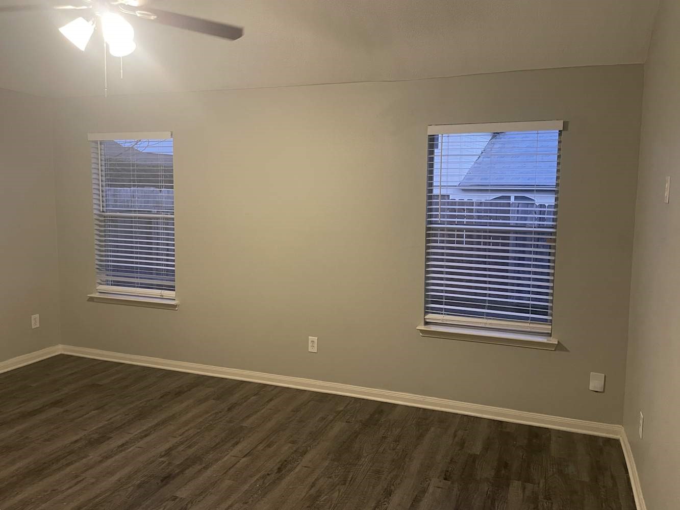 3335 Fiorella Way Humble, TX 77338 - Photo 4 of 10 a view of an empty room with wooden floor and a window