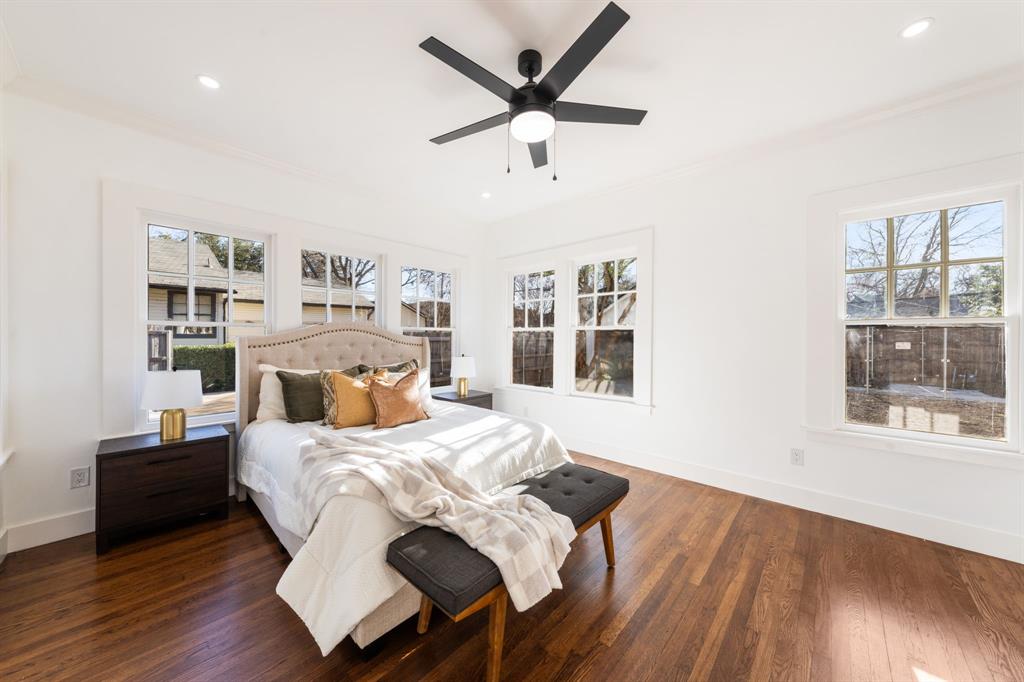 713 Ridgeway Street Dallas, TX 75214 - Photo 19 of 29 a bedroom with a bed and wooden floor