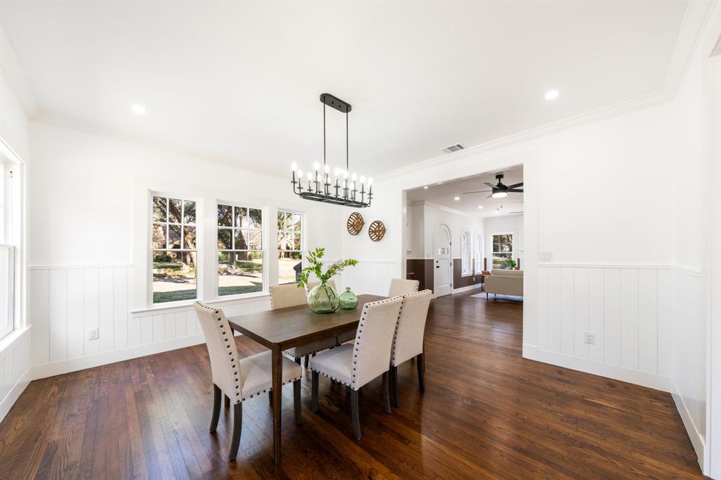 713 Ridgeway Street Dallas, TX 75214 - Photo 10 of 29 a view of a dining room with furniture and wooden floor