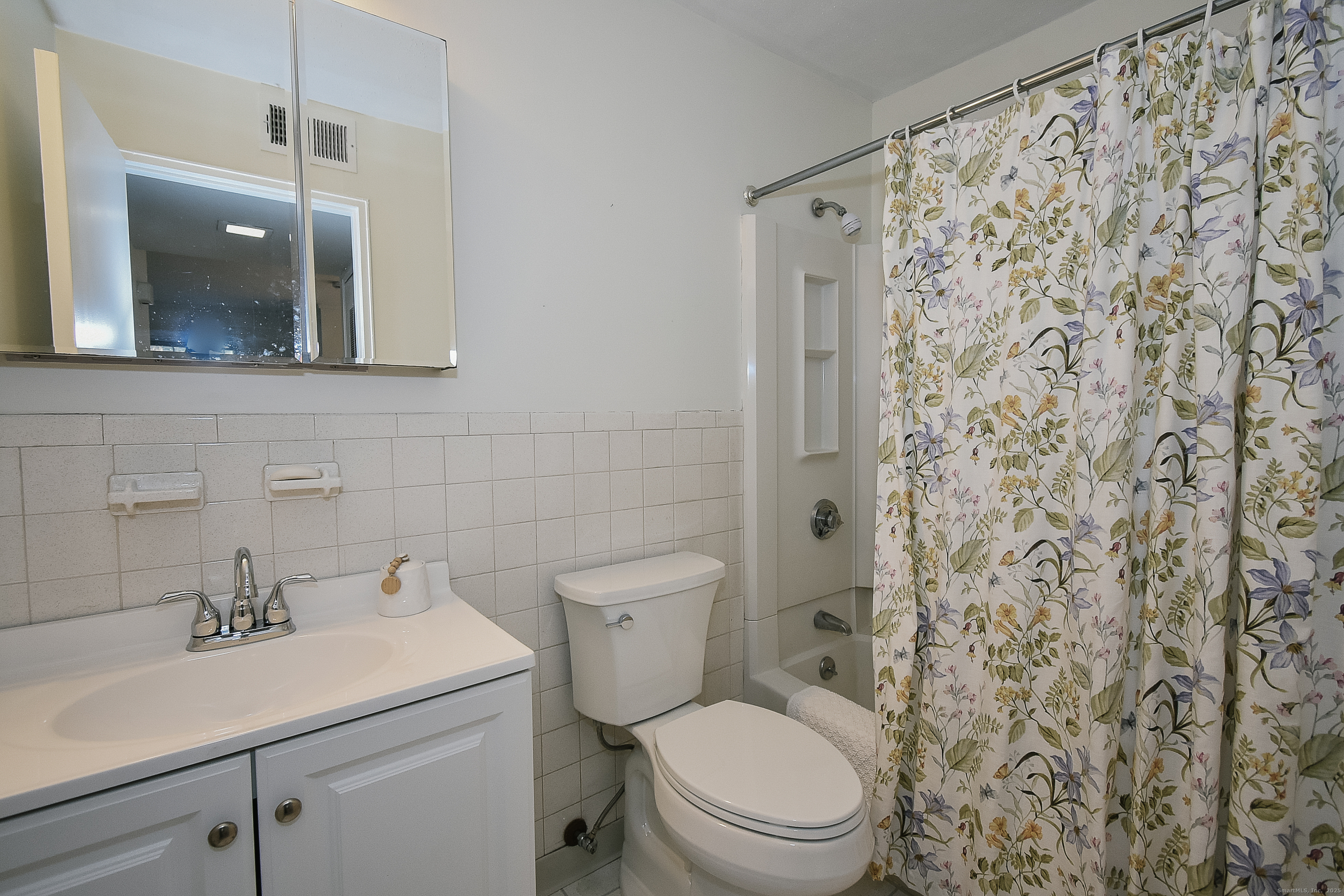 4 Georgetown Drive, Unit A Enfield, CT 06082 - Photo 11 of 20 a bathroom with a toilet sink shower and mirror