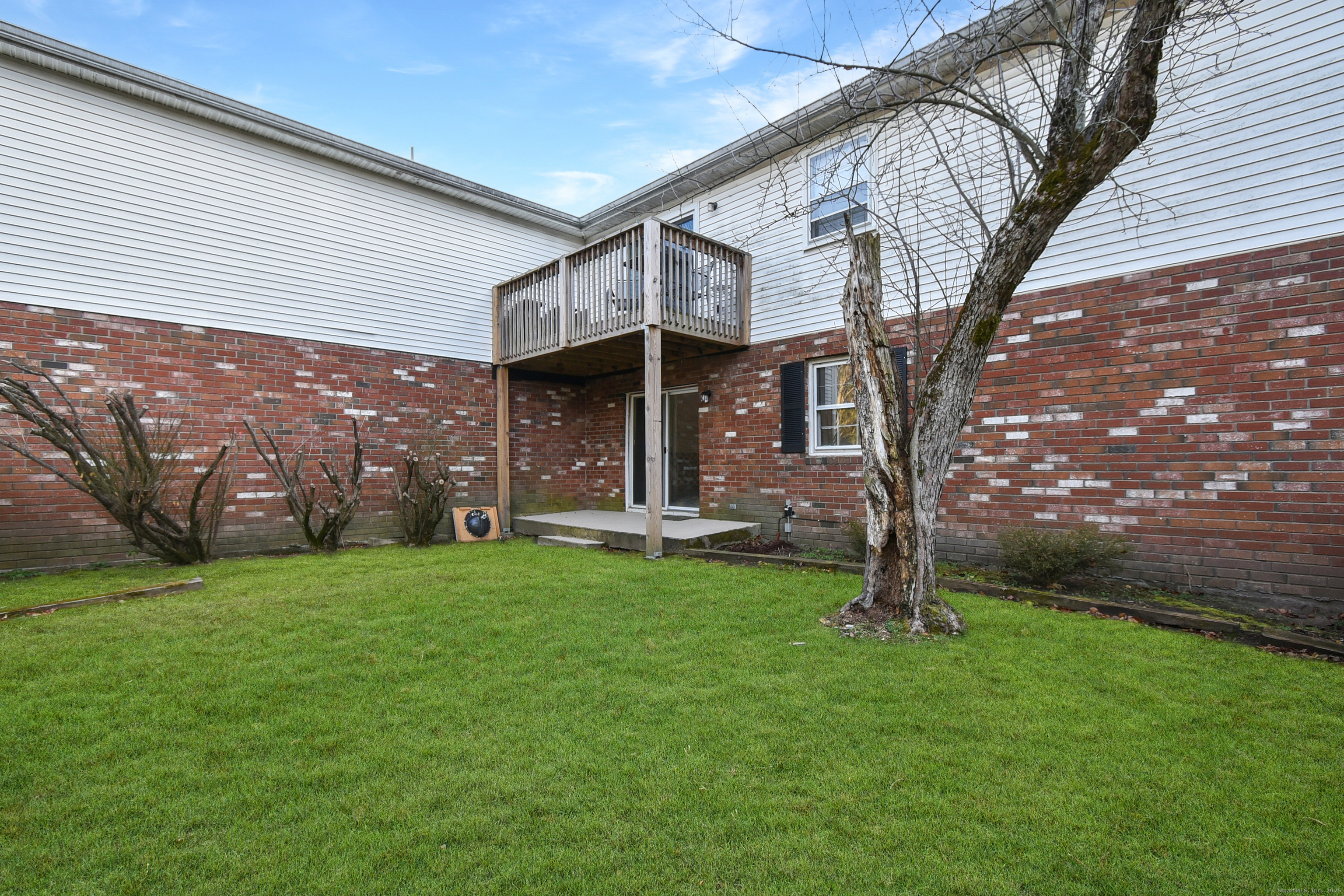 4 Georgetown Drive, Unit A Enfield, CT 06082 - Photo 20 of 20 front view of a house with a yard