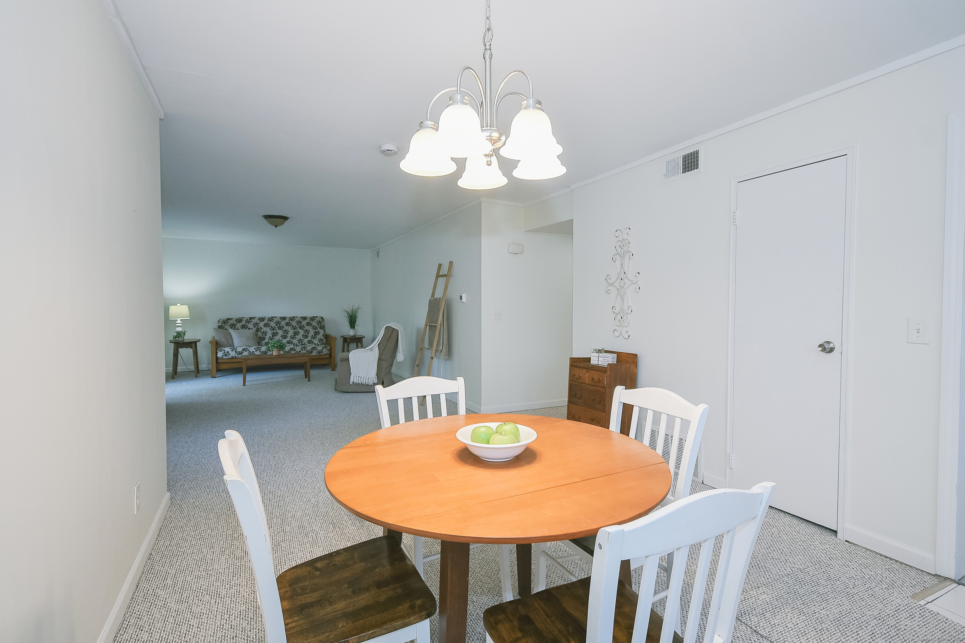4 Georgetown Drive, Unit A Enfield, CT 06082 - Photo 3 of 20 a view of a dining room with furniture and wooden floor