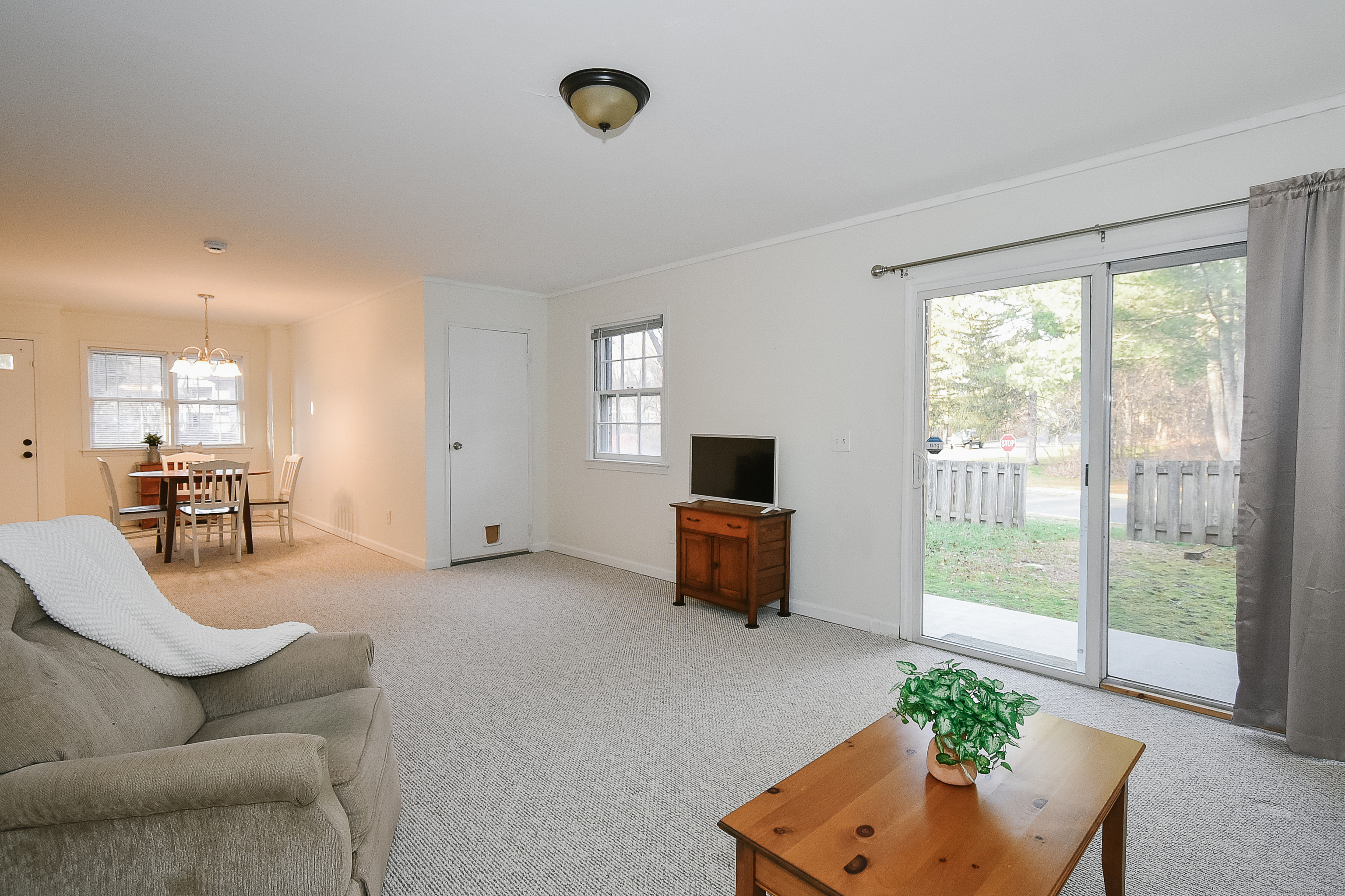 4 Georgetown Drive, Unit A Enfield, CT 06082 - Photo 5 of 20 a living room with furniture and a flat screen tv