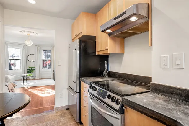 a kitchen that has a sink and a stove