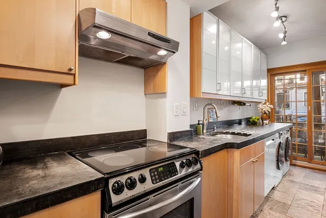 a kitchen with a stove and a sink
