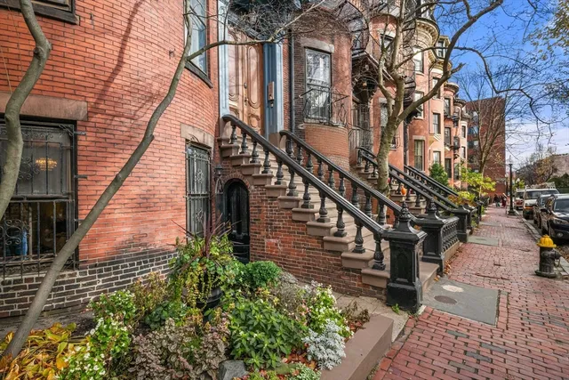 a pathway of a house with a yard