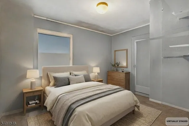 a bedroom with a bed and a table