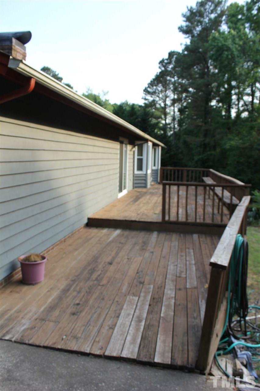 3605 Printice Place Raleigh, NC 27604 - Photo 5 of 12 48 x 12 Deck overlooking spacious private backyard and inground pool!
