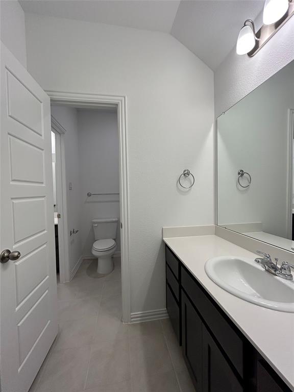 1448 Sun Gdn Way Justin, TX 76247 - Photo 22 of 28 Bathroom with vanity and light tile patterned floors