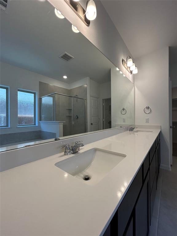 1448 Sun Gdn Way Justin, TX 76247 - Photo 25 of 28 Full bathroom featuring a stall shower and double vanity