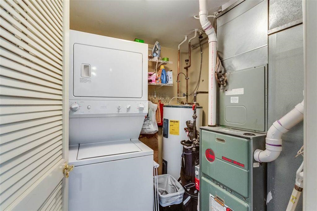 711 Clinton Street, Unit 6A Hoboken, NJ 07030 - Photo 14 of 15 a utility room with dryer and washer
