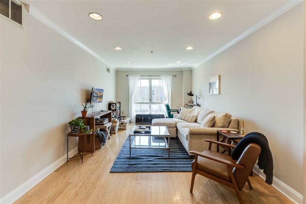 711 Clinton Street, Unit 6A Hoboken, NJ 07030 - Photo 4 of 15 a living room with furniture