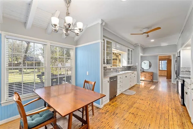 a view of a dining room with furniture window and wooden floor