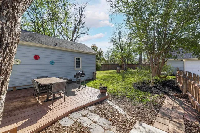 a view of a backyard with sitting area