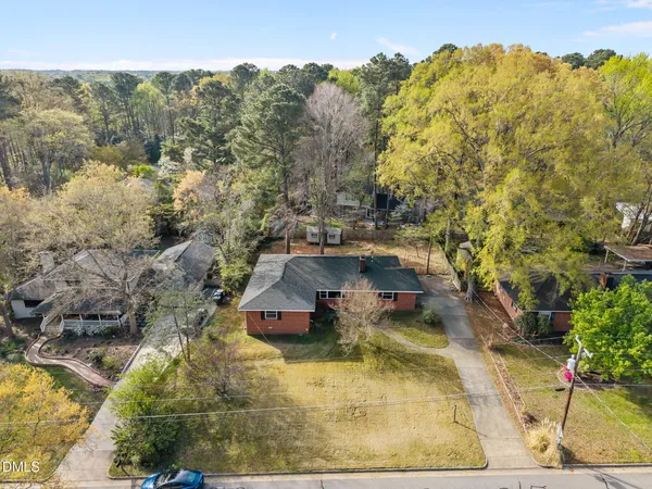a backyard of a house with large trees