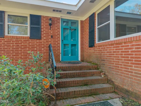 a view of house with window and stairs