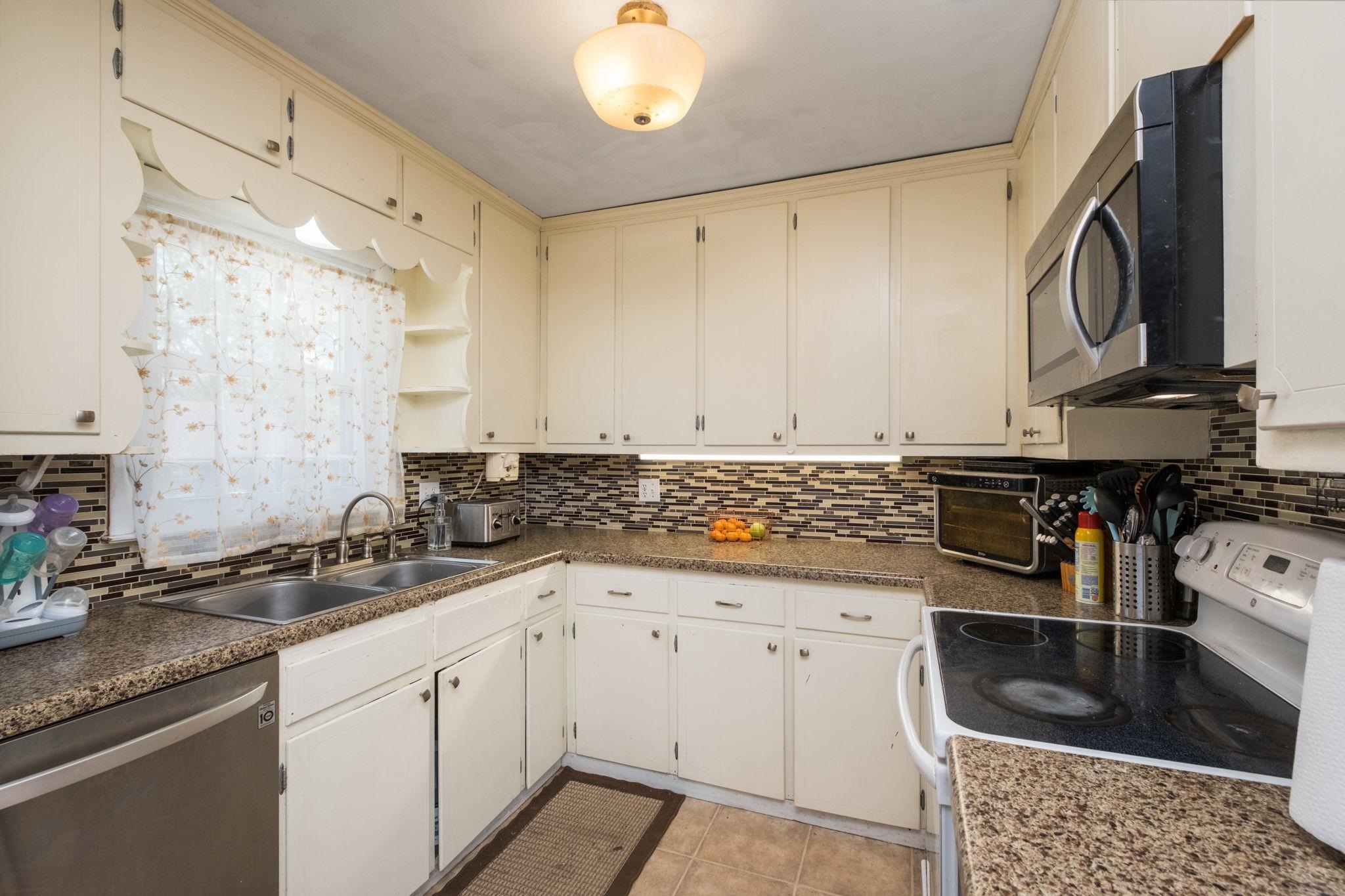 8208 George Wine Road Bridgewater, VA 22812 - Photo 5 of 27 a kitchen with stainless steel appliances a sink stove and cabinets