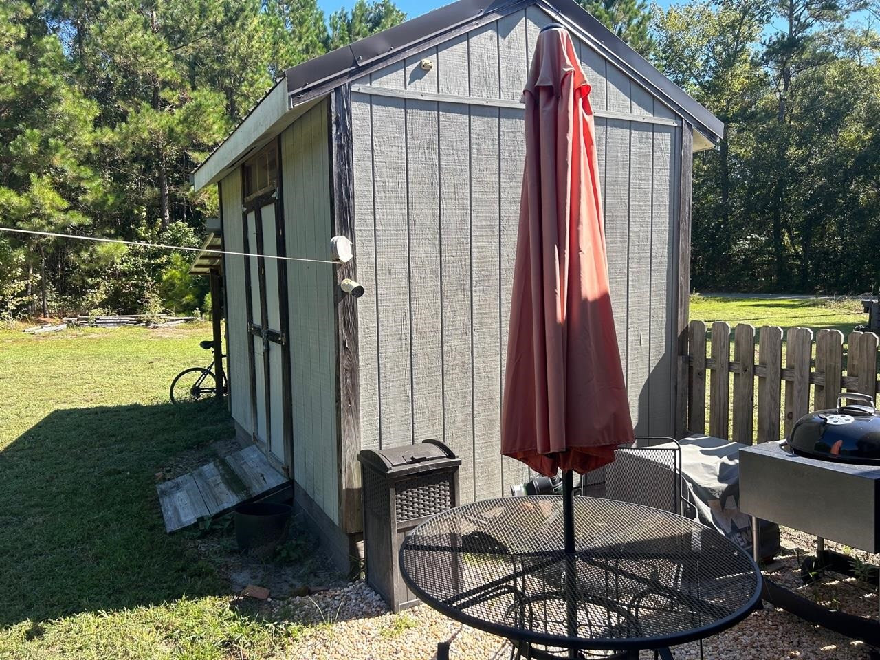 135 Barnhill Road Ivanhoe, NC 28447 - Photo 5 of 23 a view of backyard with swimming pool and outdoor seating