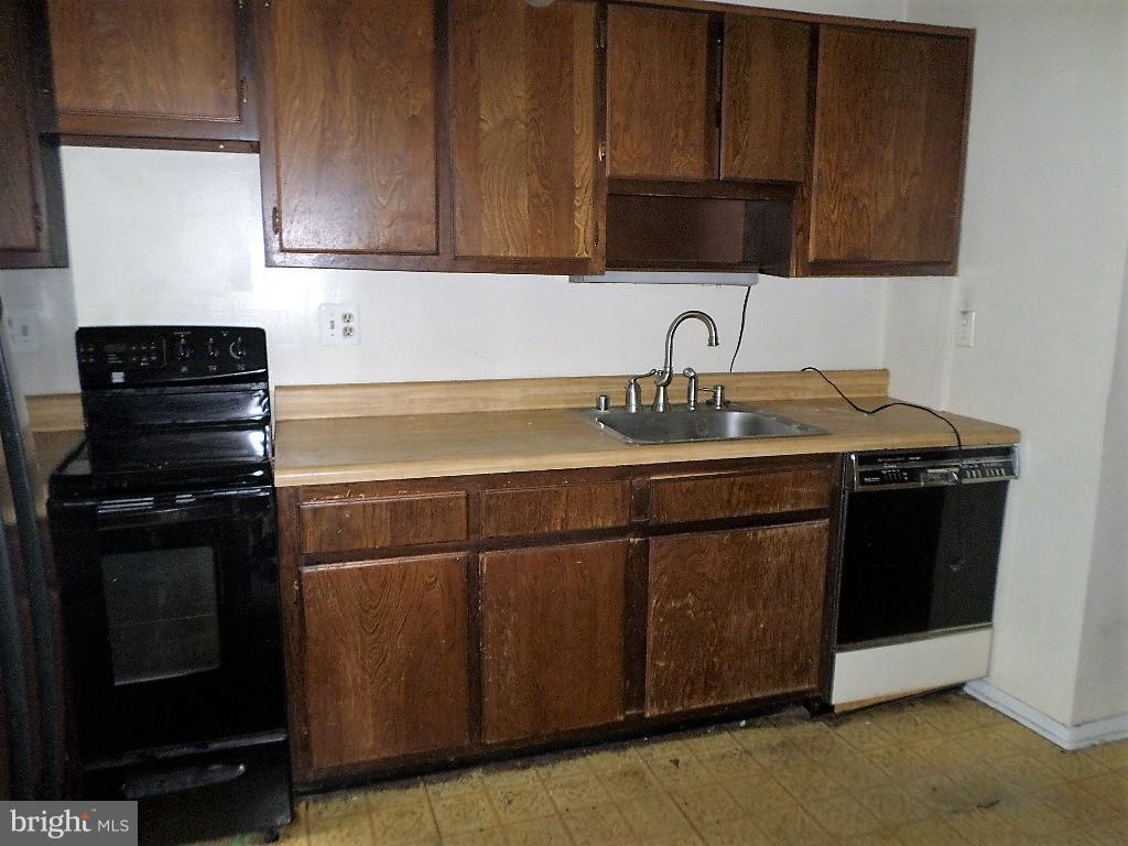 3407 Santee Road Baltimore, MD 21236 - Photo 2 of 22 a kitchen with a sink and a stove