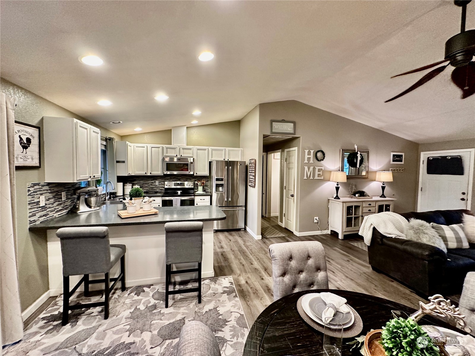 18120 Sunshine Lane Southwest Rochester, WA 98579 - Photo 14 of 39 a living room with furniture kitchen view and a table
