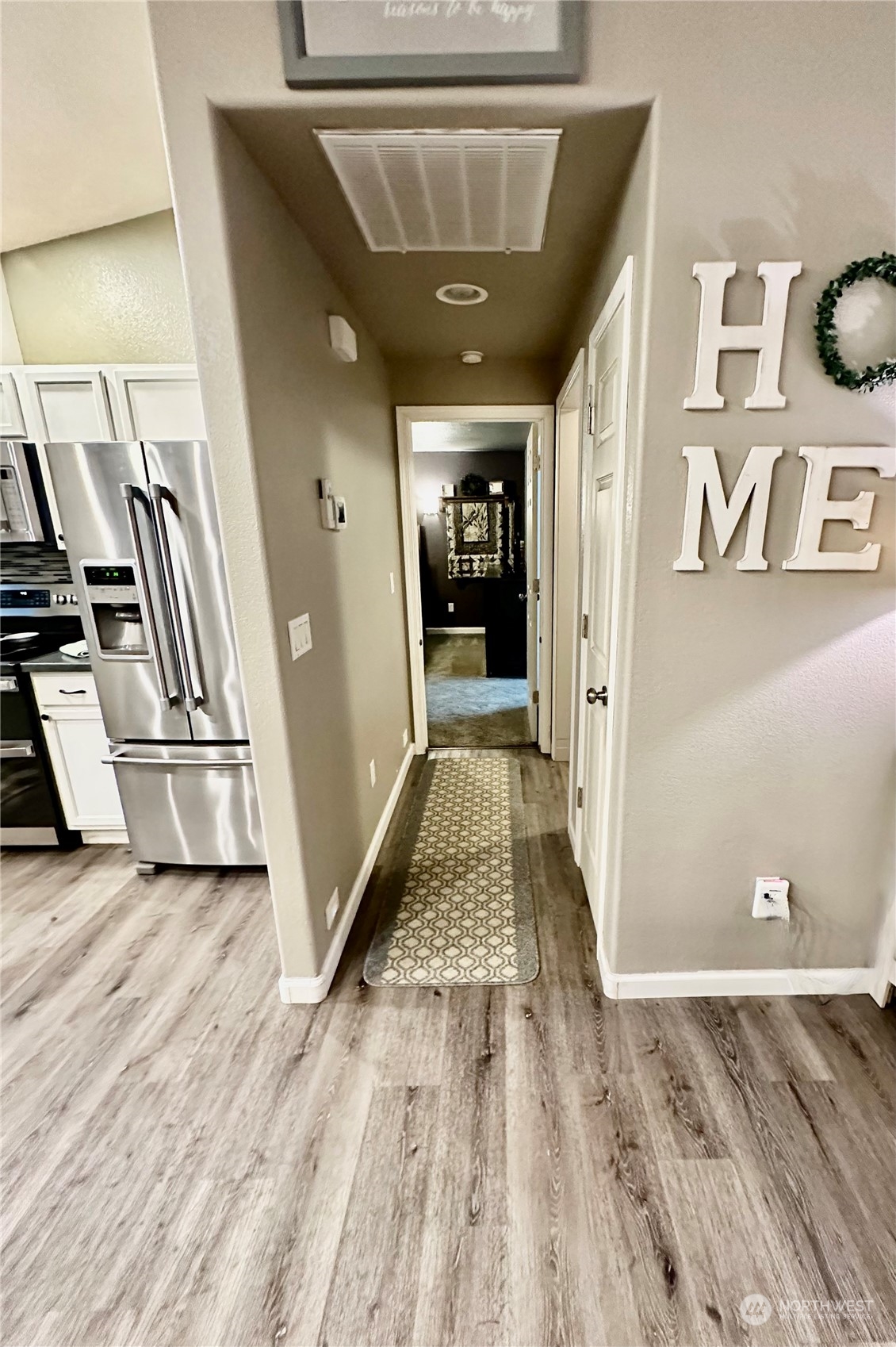 18120 Sunshine Lane Southwest Rochester, WA 98579 - Photo 17 of 39 a view of a hallway with wooden floor and staircase