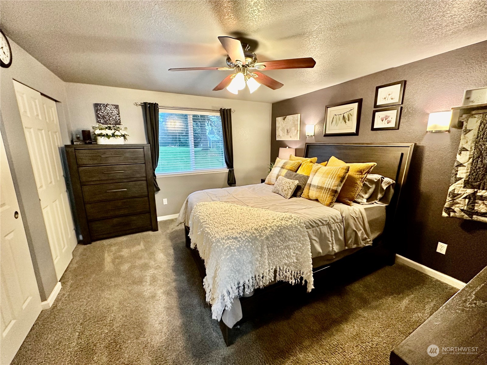 18120 Sunshine Lane Southwest Rochester, WA 98579 - Photo 18 of 39 a bedroom with a bed and wooden floor