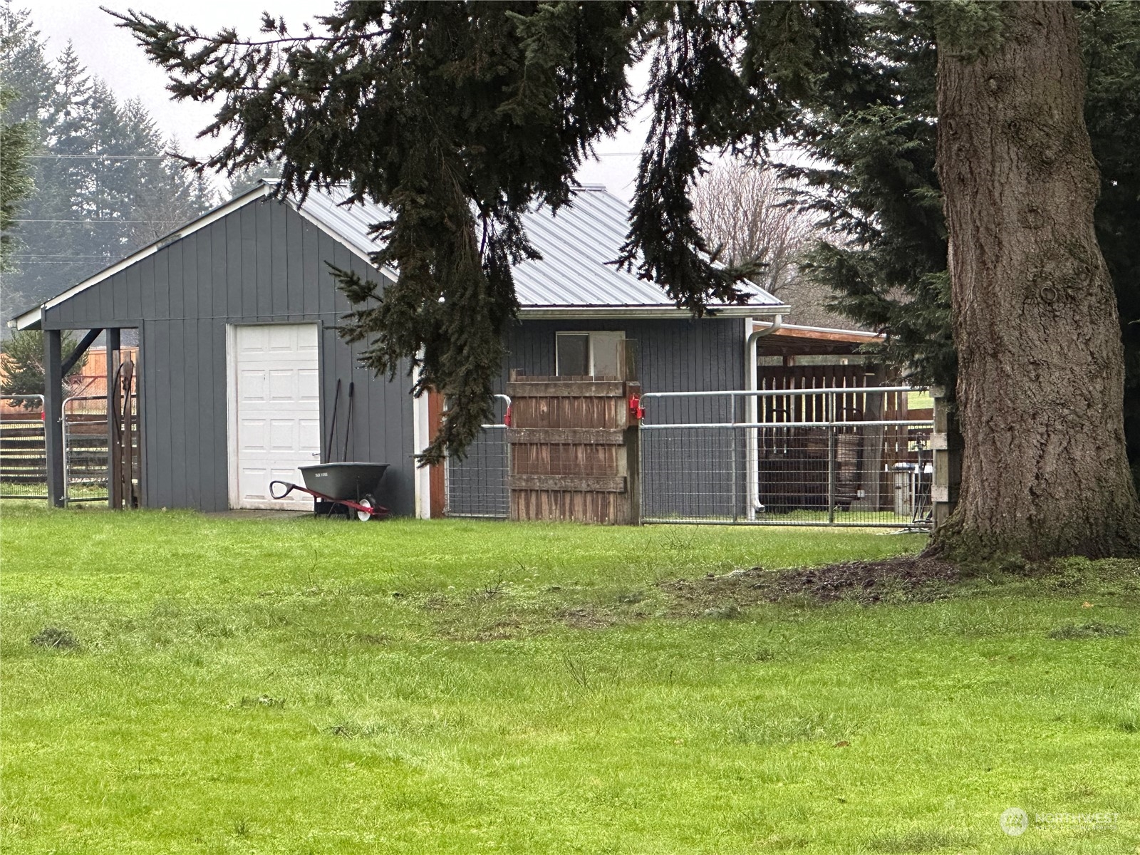 18120 Sunshine Lane Southwest Rochester, WA 98579 - Photo 2 of 39 a house with huge green field in front of it