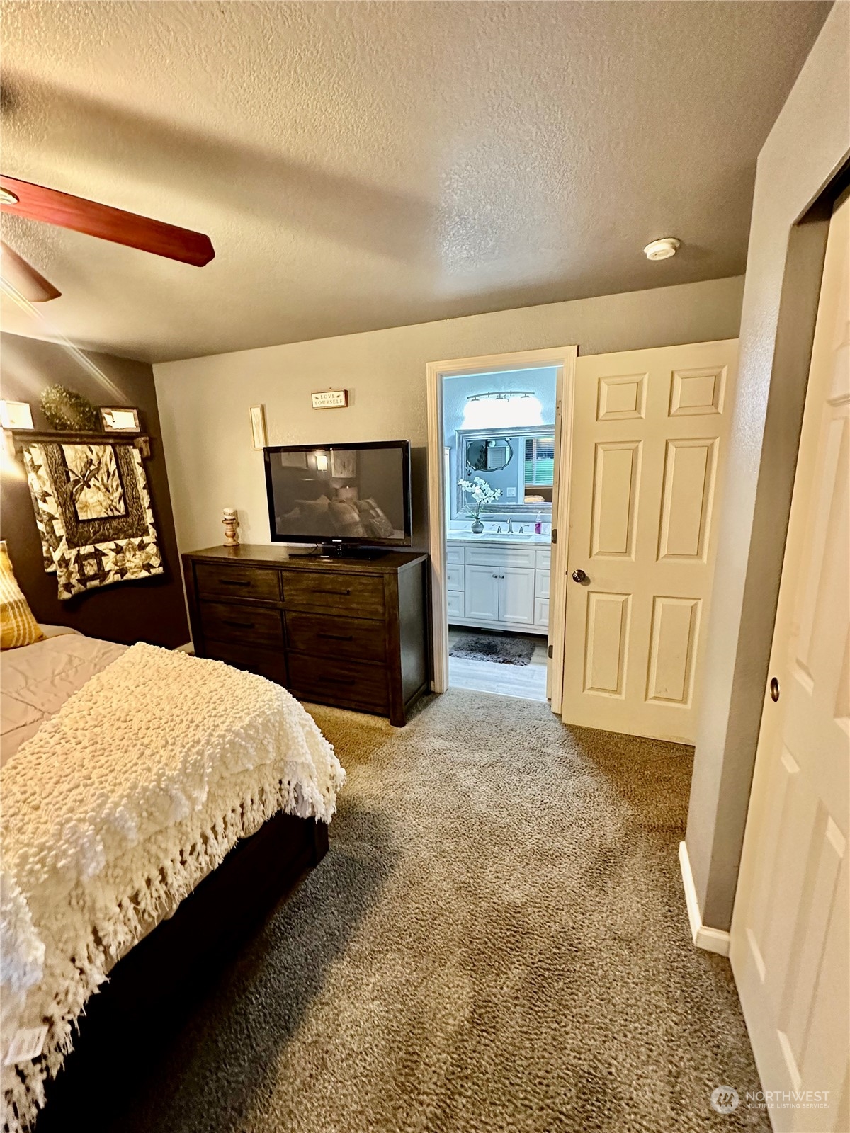 18120 Sunshine Lane Southwest Rochester, WA 98579 - Photo 21 of 39 a large bedroom with a bed and furniture