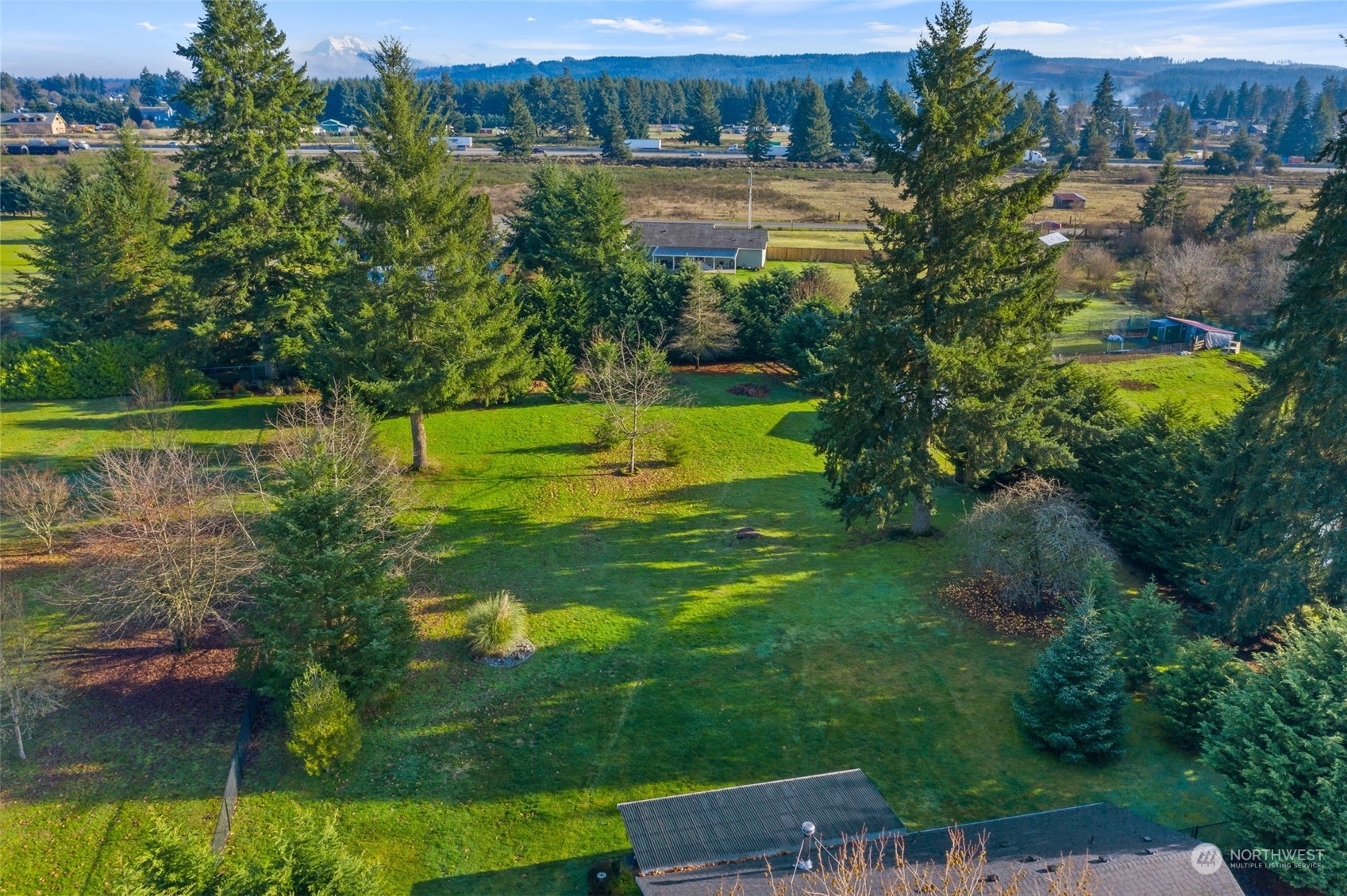 18120 Sunshine Lane Southwest Rochester, WA 98579 - Photo 3 of 39 a view of a lake with a yard