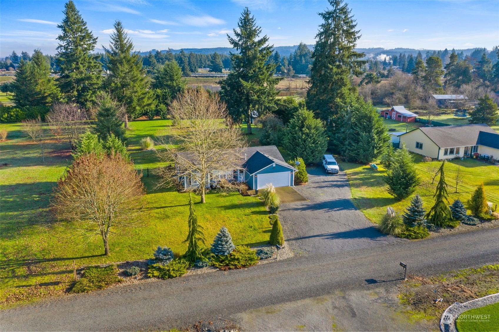 18120 Sunshine Lane Southwest Rochester, WA 98579 - Photo 5 of 39 a view of a swimming pool with a yard