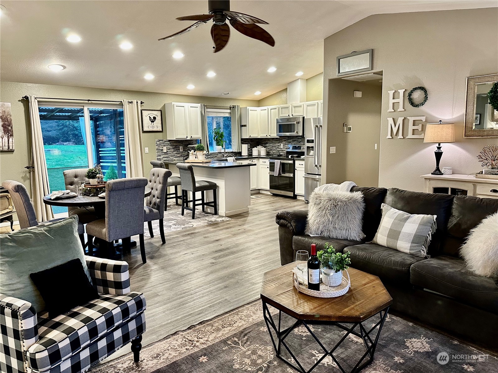 18120 Sunshine Lane Southwest Rochester, WA 98579 - Photo 10 of 39 a living room with furniture kitchen view and a large window