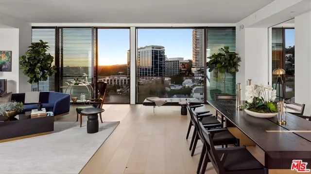 a work room with furniture and a potted plant