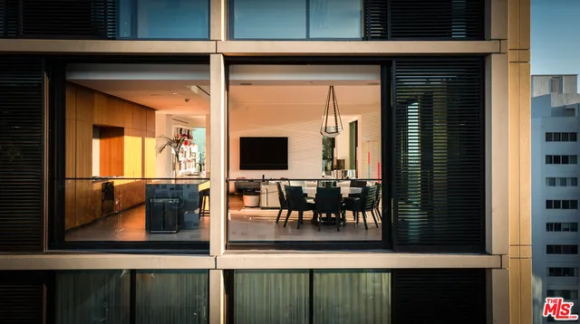 a view of a living room and a balcony