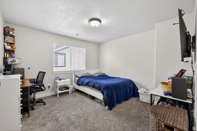 412 McClellan Court Provo, UT 84601 - Photo 14 of 20 Carpeted bedroom with an office area and a textured ceiling