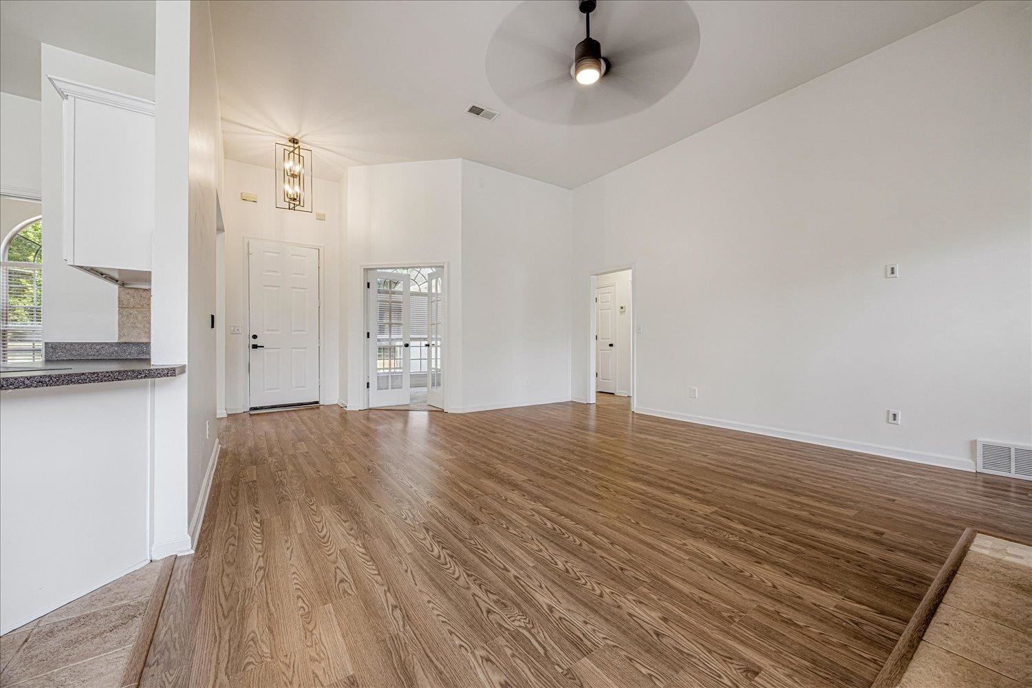 8453 Thor Road Memphis, TN 38018 - Photo 13 of 29 wooden floor in an empty room with a window