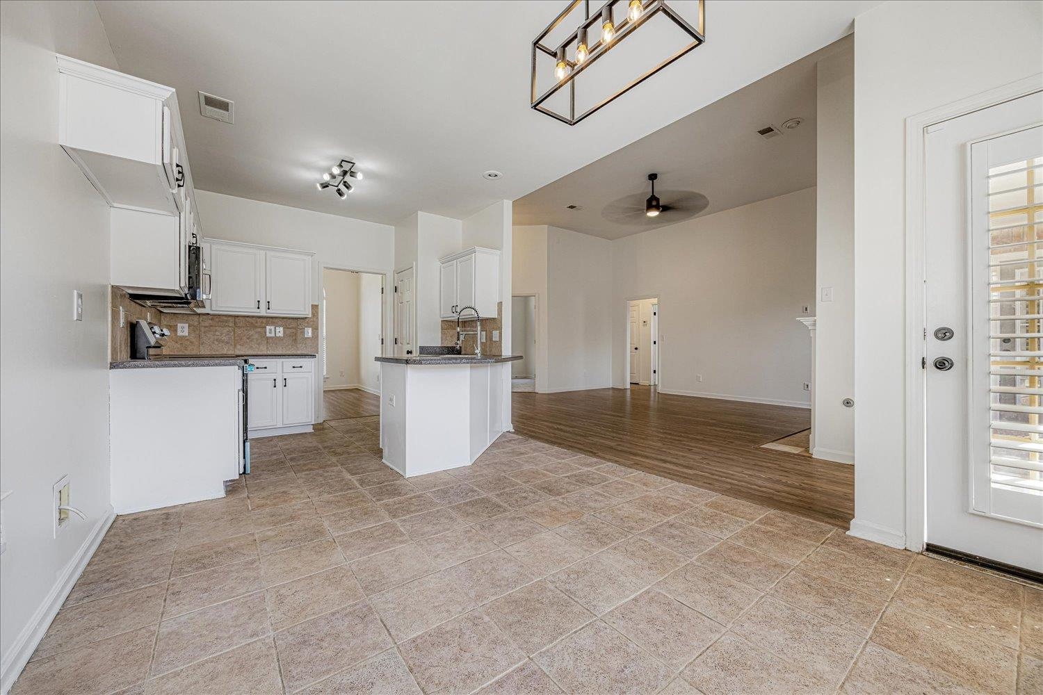8453 Thor Road Memphis, TN 38018 - Photo 29 of 29 a view of a kitchen with wooden floor and electronic appliances