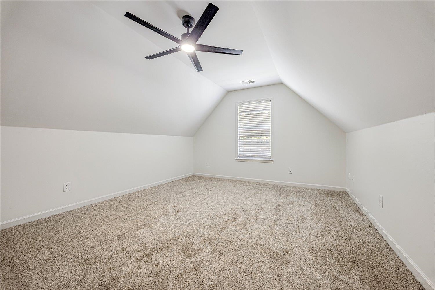 8453 Thor Road Memphis, TN 38018 - Photo 22 of 29 an empty room with a window and a fan