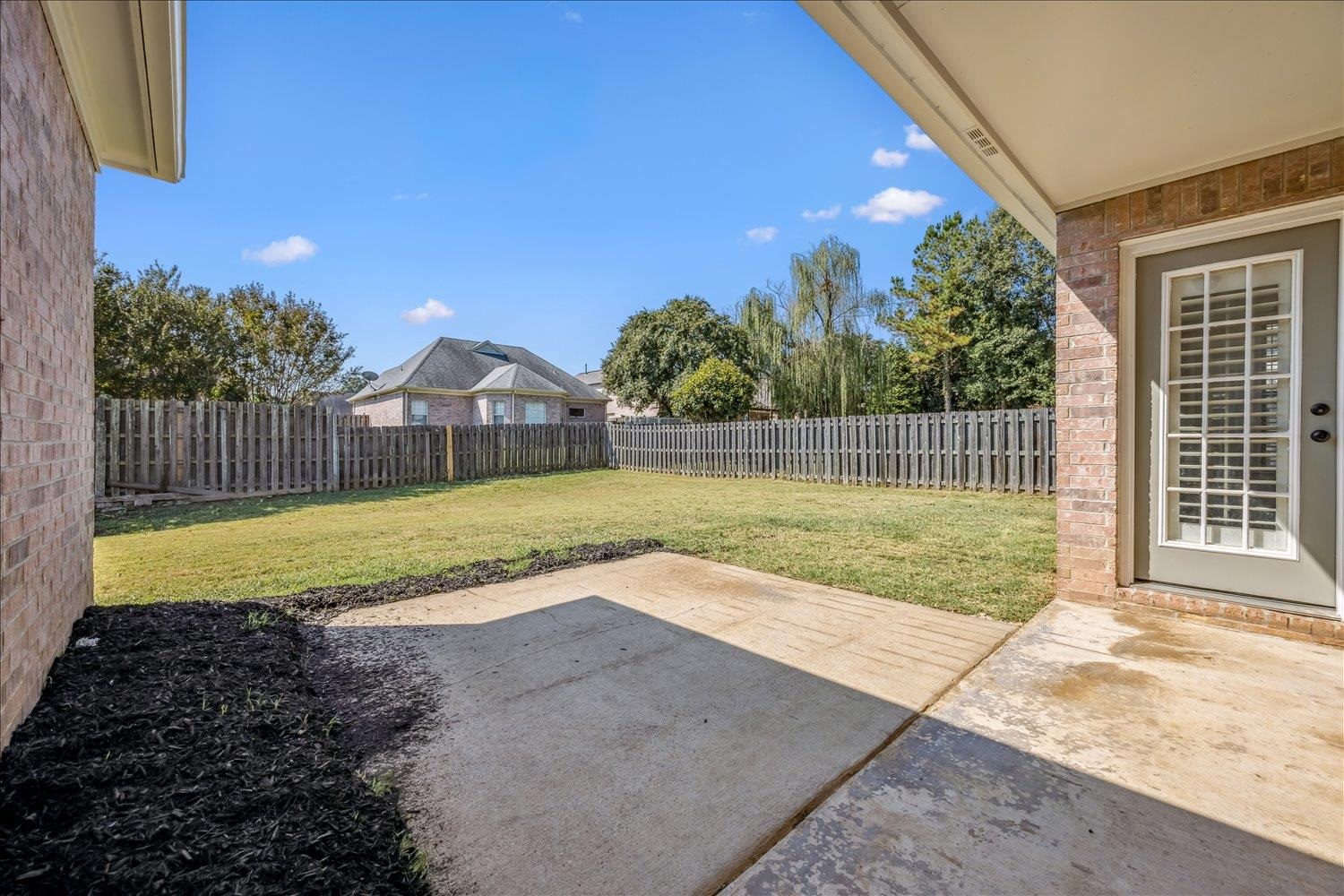 8453 Thor Road Memphis, TN 38018 - Photo 24 of 29 a view of a backyard with swimming pool and seating space